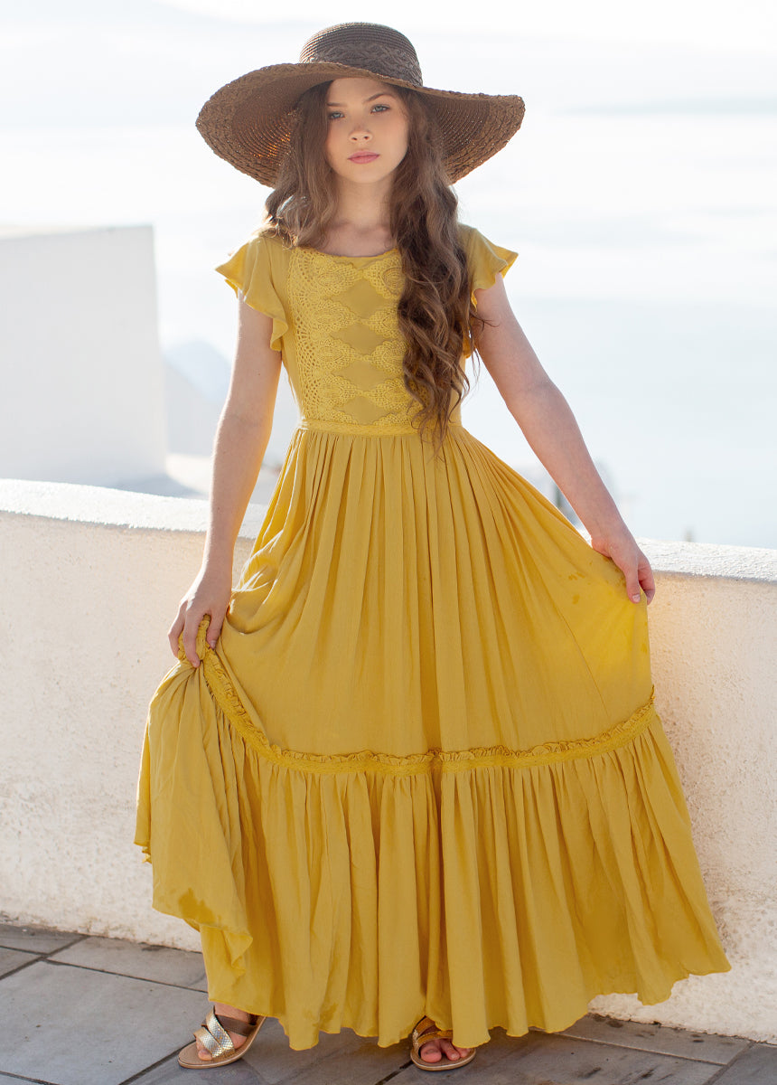 mustard yellow colour dress Mustard yellow is very vibrant color on dark skin. Dress from her bride & entourage..call us on 0775989415
